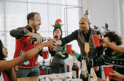 A group of people in party hats

Description automatically generated